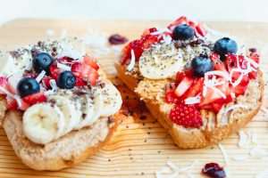 french toasted bread with lots of berries and creams