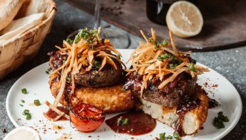 beef patties served on crispy potato cakes with rich sauce for a delicious quick dinner ideas